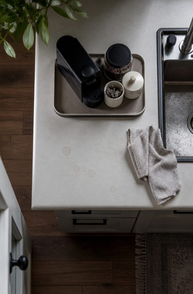 24 Modern Coffee Bar Design Ideas for Any Home Layout 2 Coffee maker and bean canister arranged on a kitchen counter beside mugs