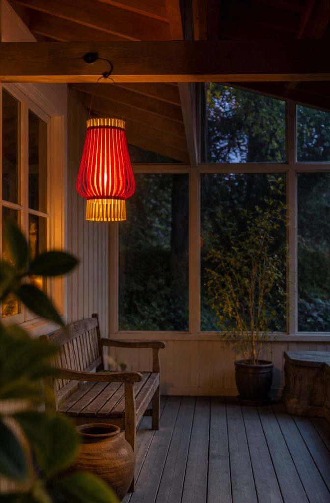 How to Make a Lantern: 7 Steps to a Paper Lantern at Home 10 Red paper lantern with yellow fringe liner showing beneath its base